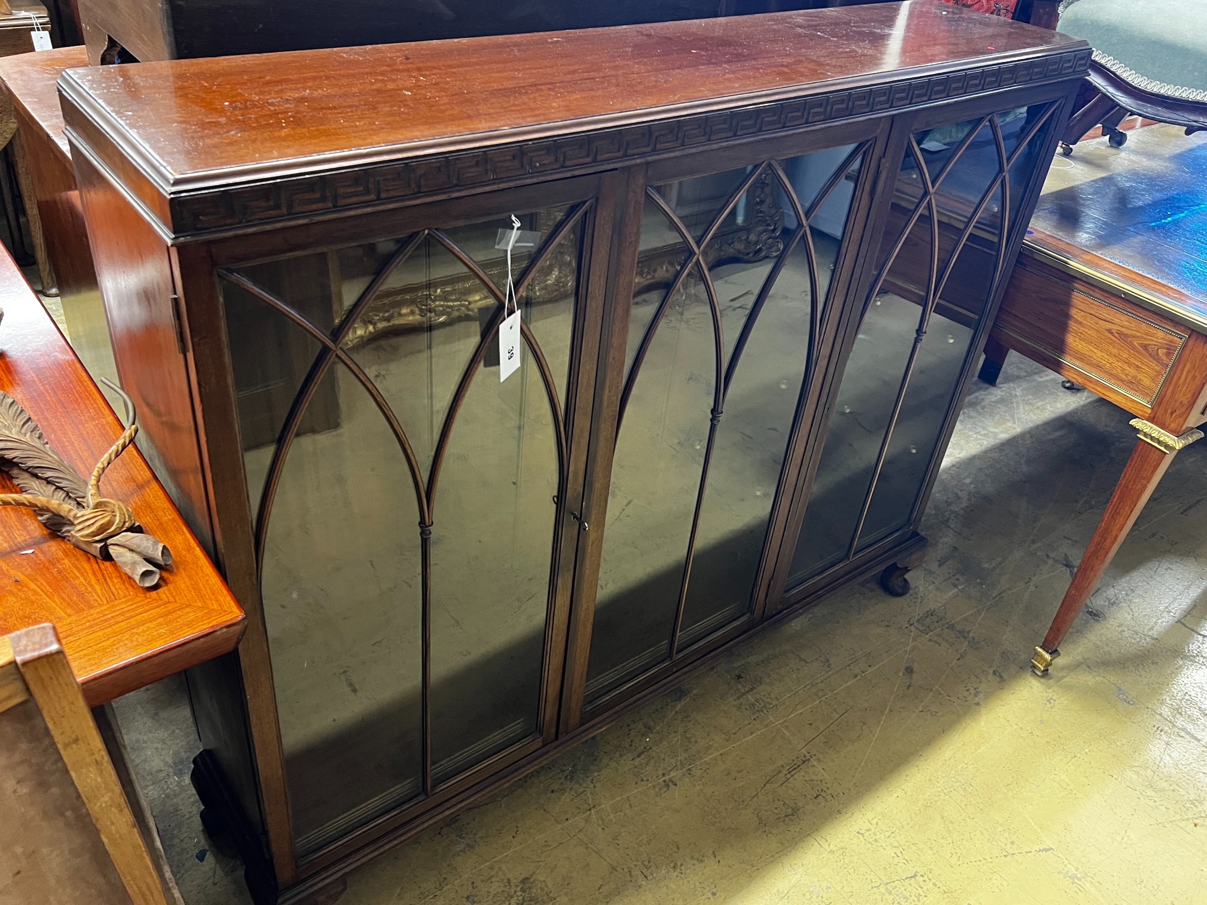 An early 20th century George III style mahogany bookcase, width 132cm, depth 29cm, height 108cm